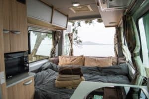 inside a campervan and the outside scenery