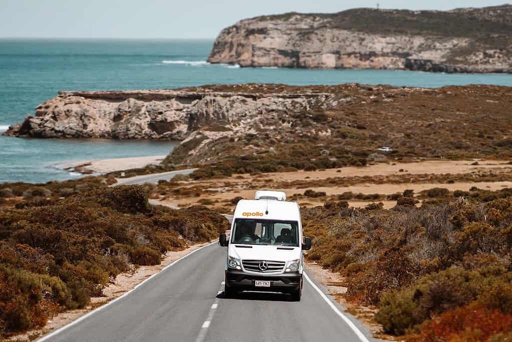Apollo motorhome driving a sealed coastal road in South Australia
